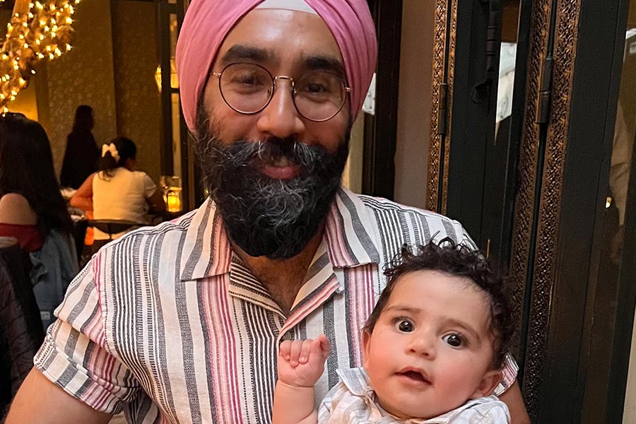 Angad with his young son.