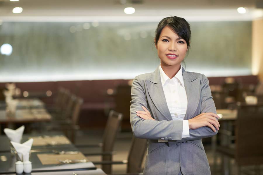 singh-industry-hospatility-body Hospitality, photo of woman, owner, standing in restaurant.