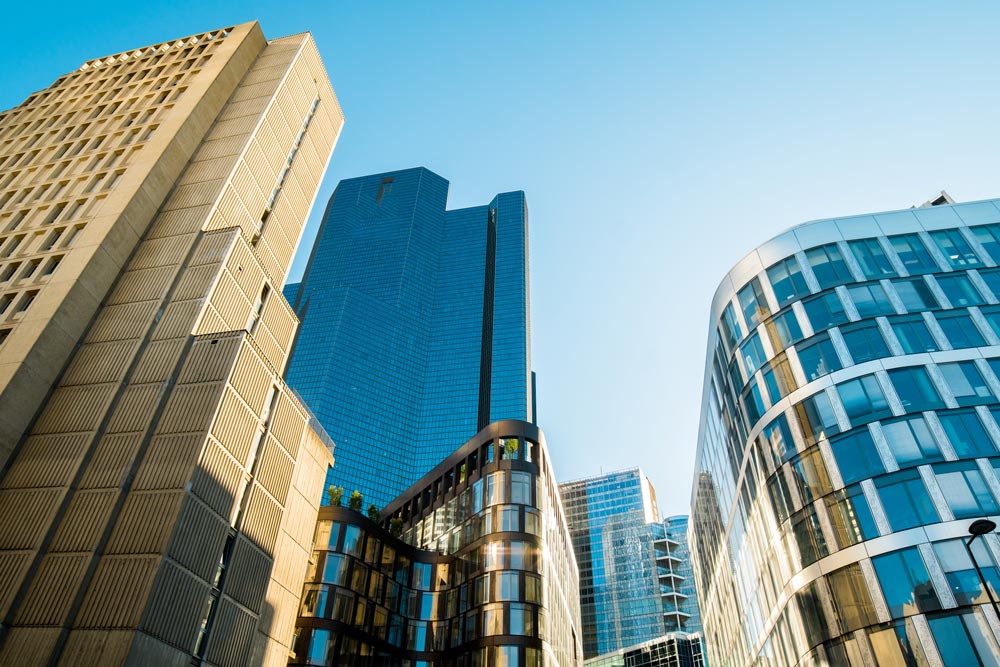 Real Estate Accounting Tax and Audit Services Real Estate buildings rising to the sky.