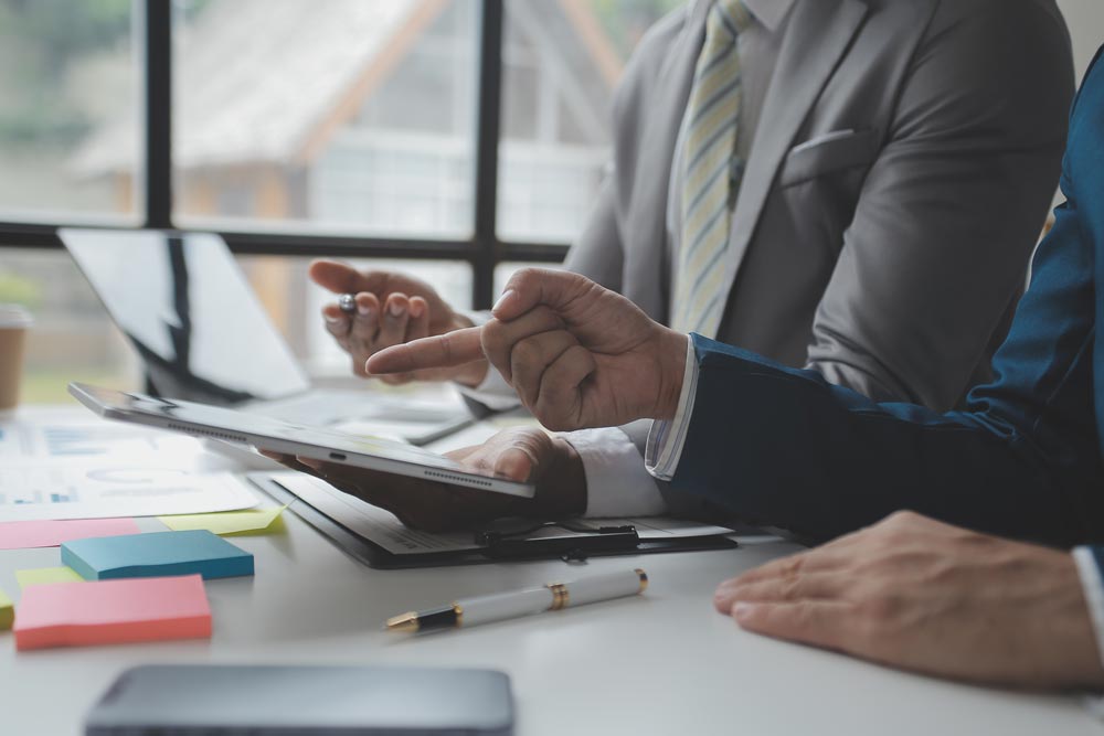 Singh and Associates Business Services - SALT Business people reviewing tax documents for SALT deductions.
